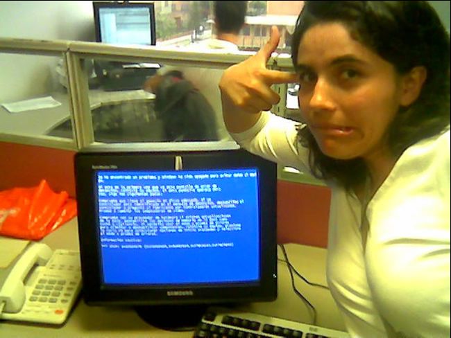 Woman with blue screen of death on old Windows computer